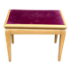 Adjustable piano stool in light beech and purple velvet.