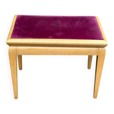 Adjustable piano stool in light beech and purple velvet.