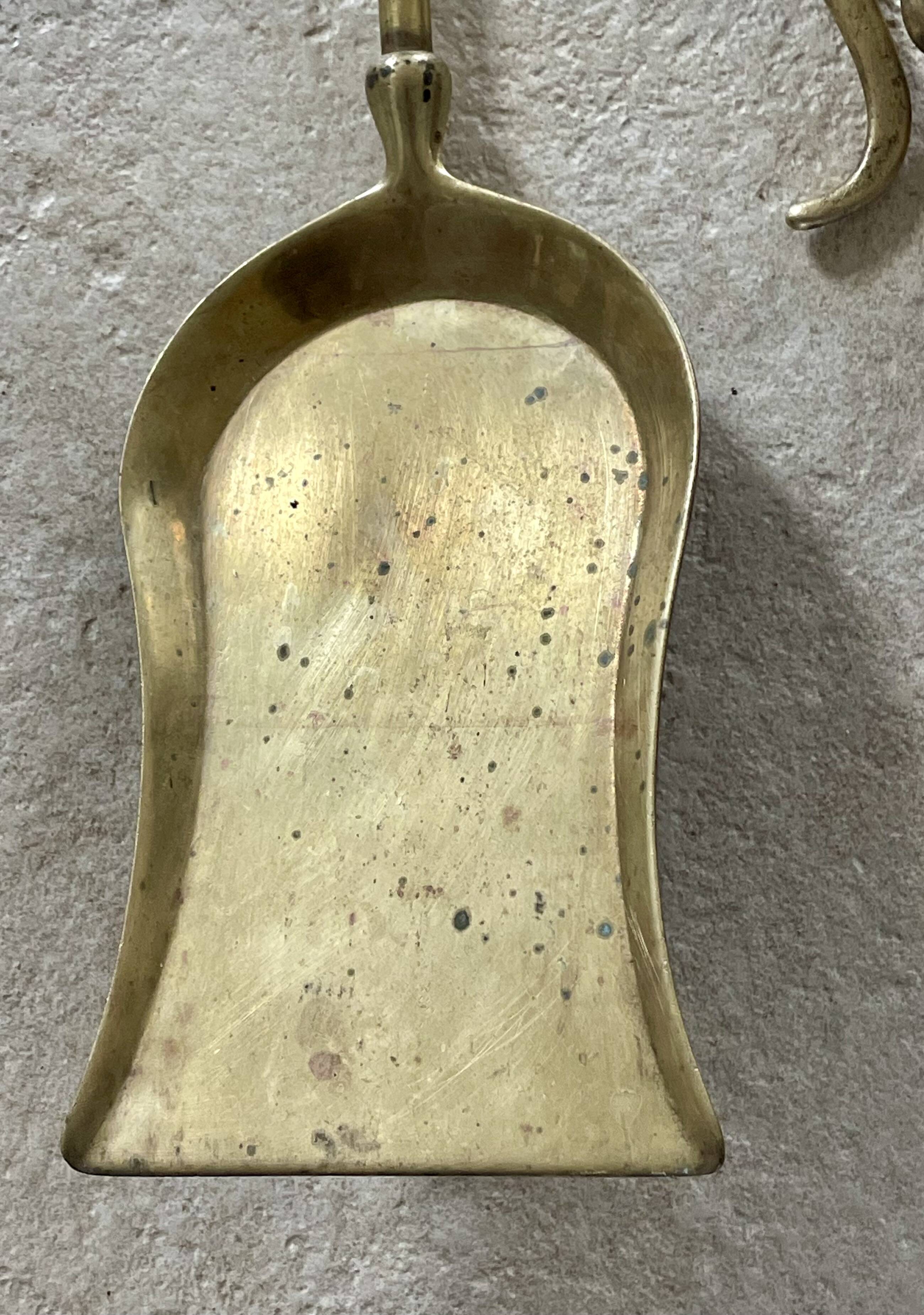 Brass fireplace accessory set with vintage stand