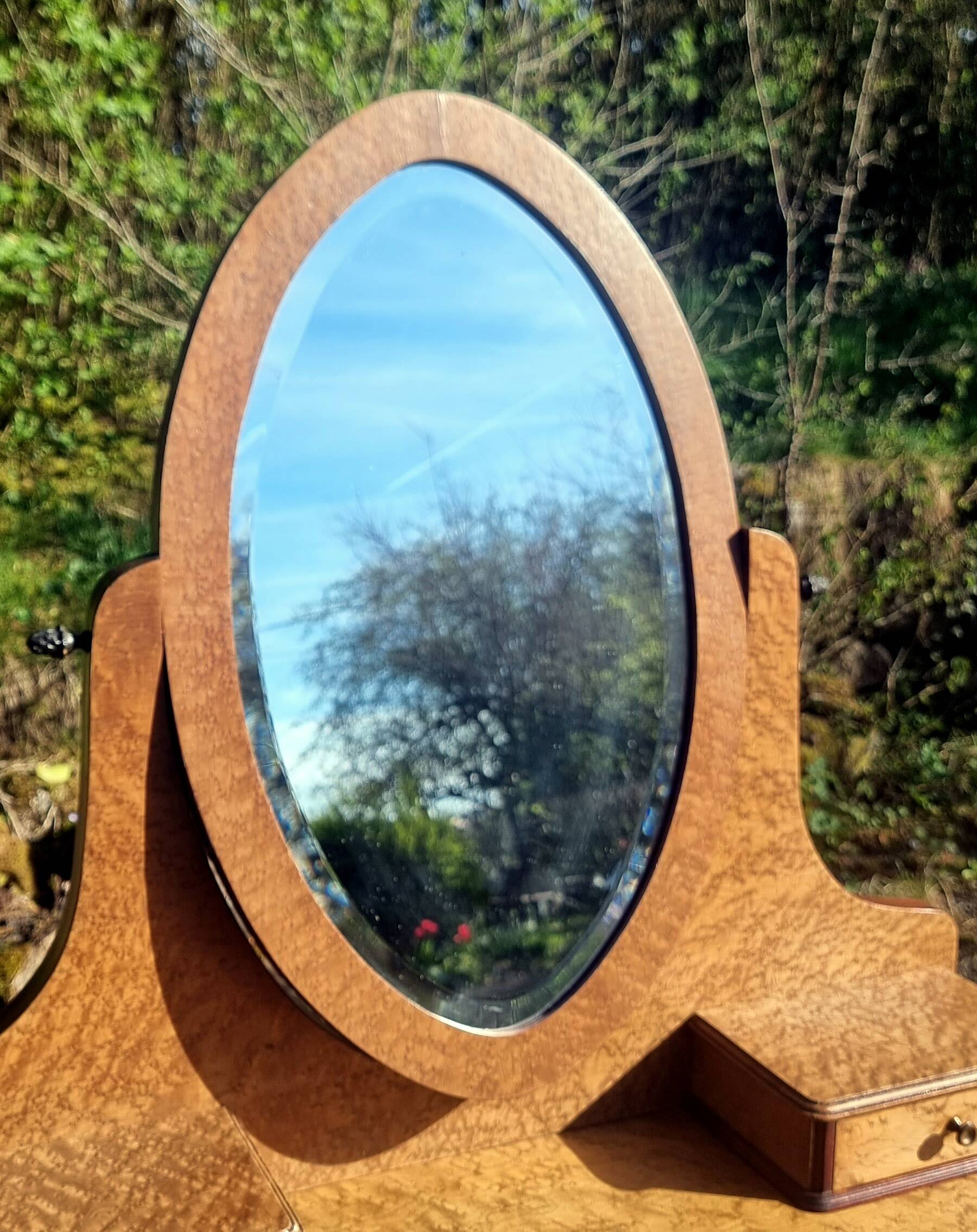 Dresser from the early 19th century with a cheval mirror.