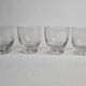 Set of four Art Deco style engraved crystal glasses on spherical feet