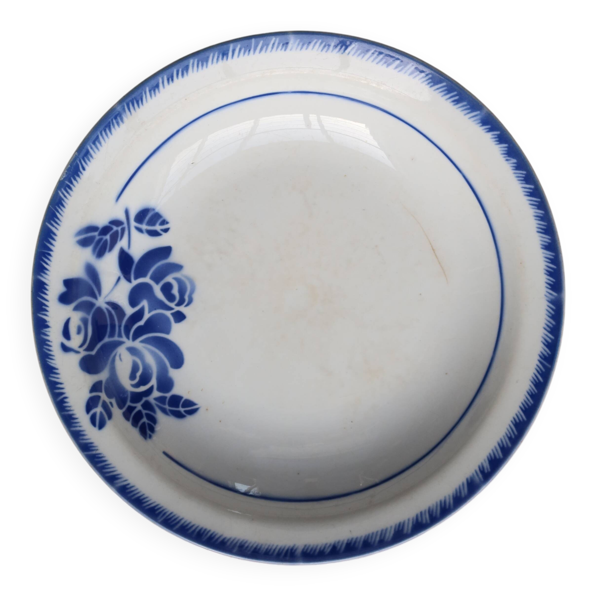 Antique shallow dish from Badonviller with blue flower decoration.