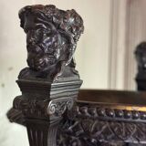 Patinated bronze vase with handles topped by bicéphalic busts, 19th century.