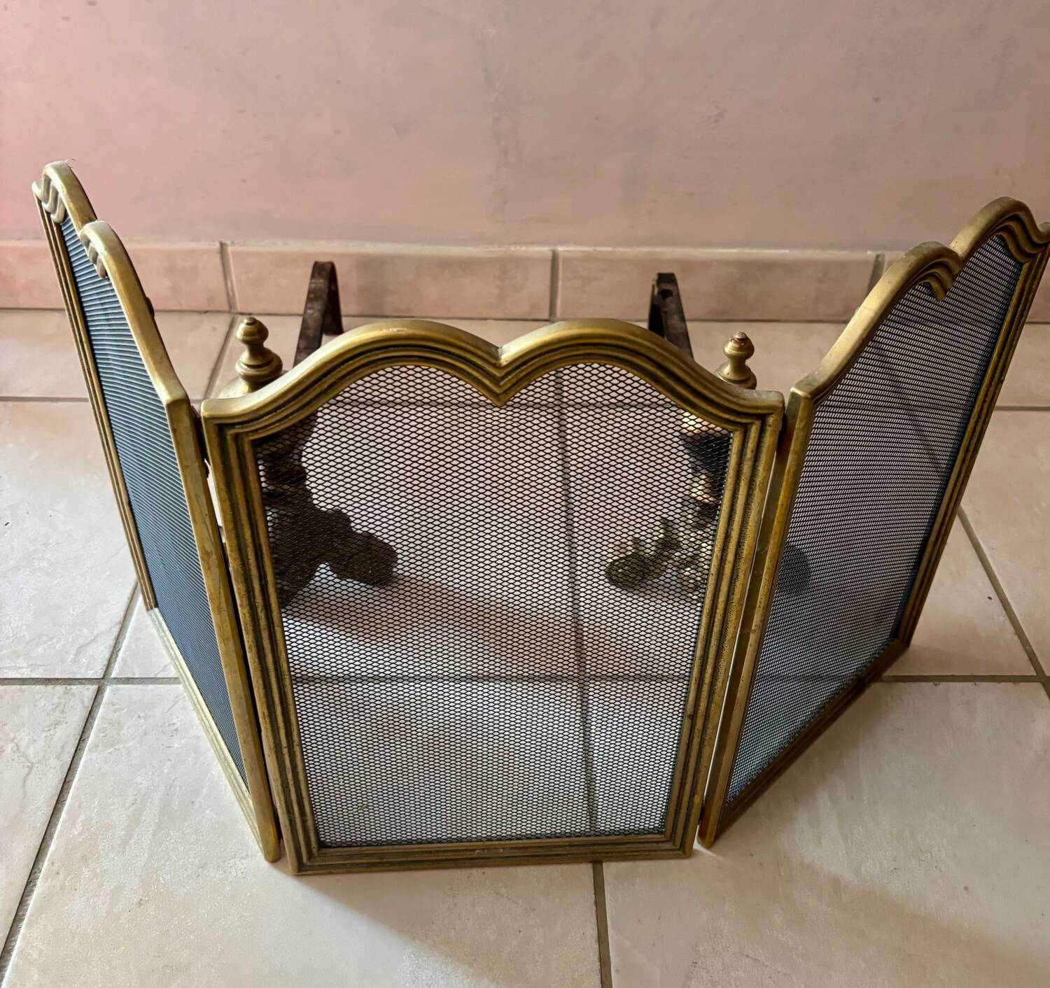 Gold wrought iron andiron and log holder for fireplace with grate