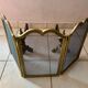 Gold wrought iron andiron and log holder for fireplace with grate