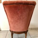 Petit fauteuil capitonné