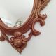 Classic red and gold patinated rocaille mirror, 35 cm x 23 cm