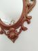 Classic red and gold patinated rocaille mirror, 35 cm x 23 cm