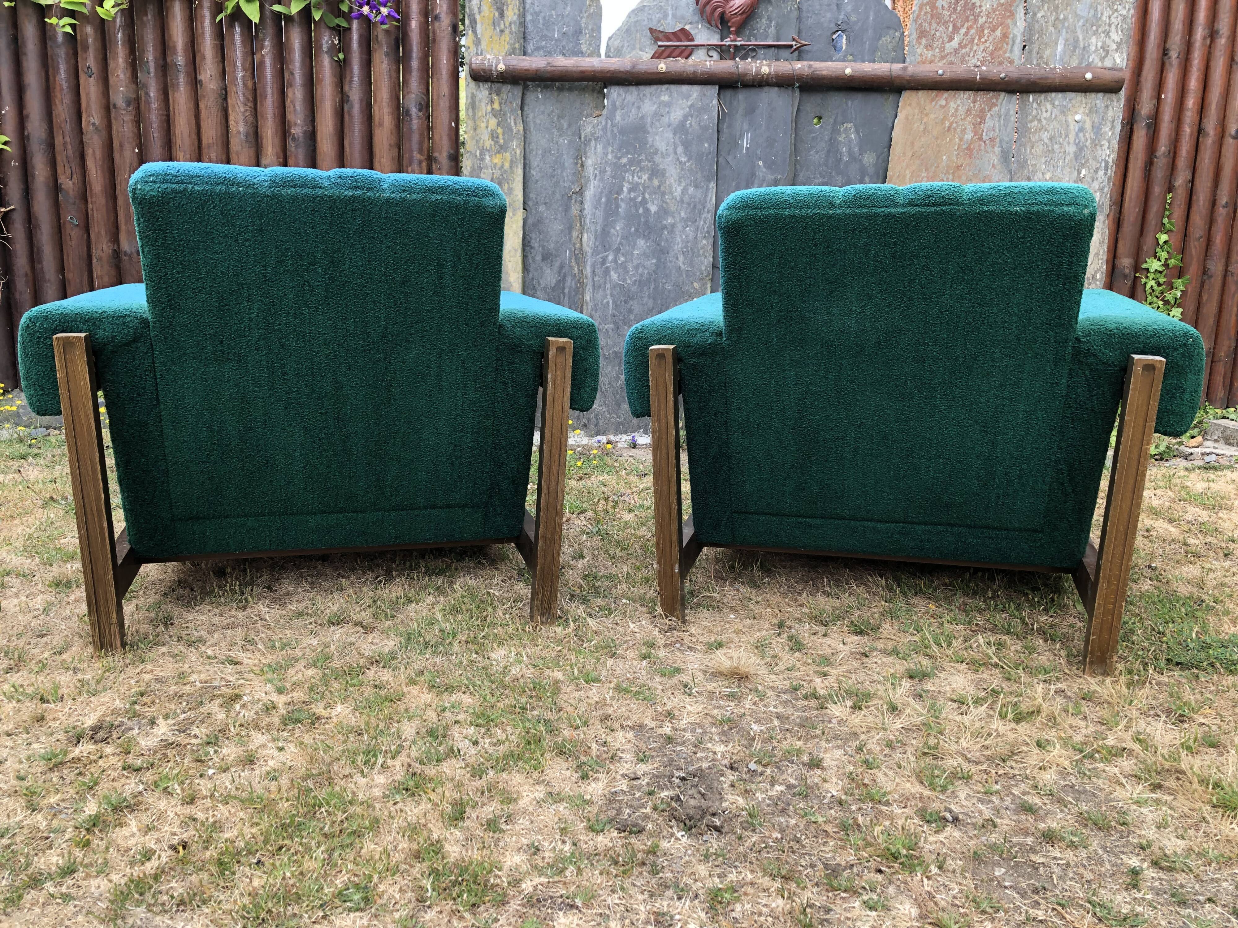 Duo of vintage armchairs with green fabrics.