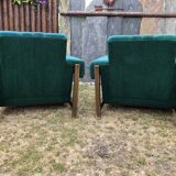 Duo of vintage armchairs with green fabrics.
