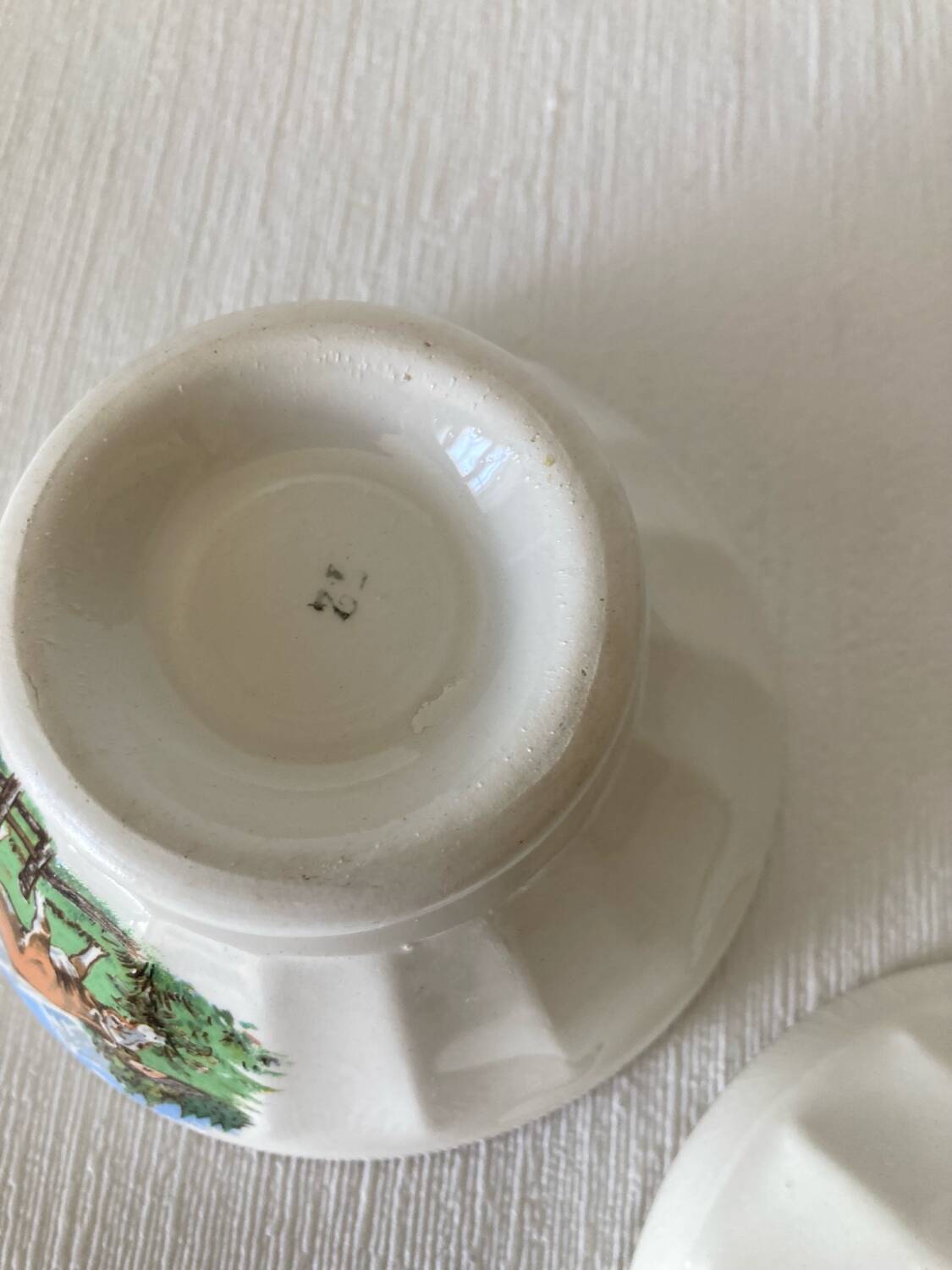 Pair of small faceted bowls with cow illustrations from the 40s and 50s