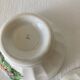 Pair of small faceted bowls with cow illustrations from the 40s and 50s