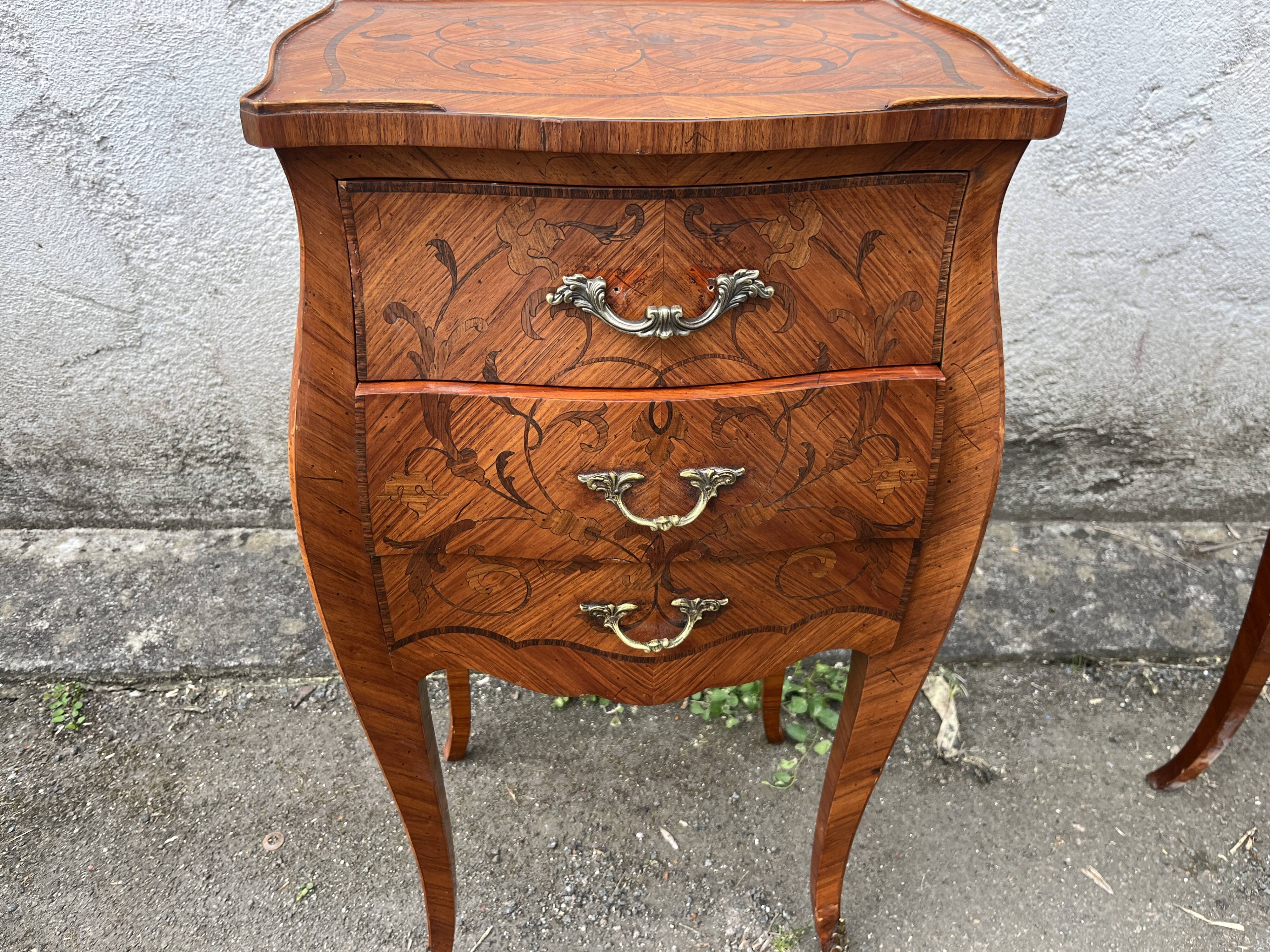 Pair of bedside tables with bombé shape, marquetry, and bronze in Louis XV style.