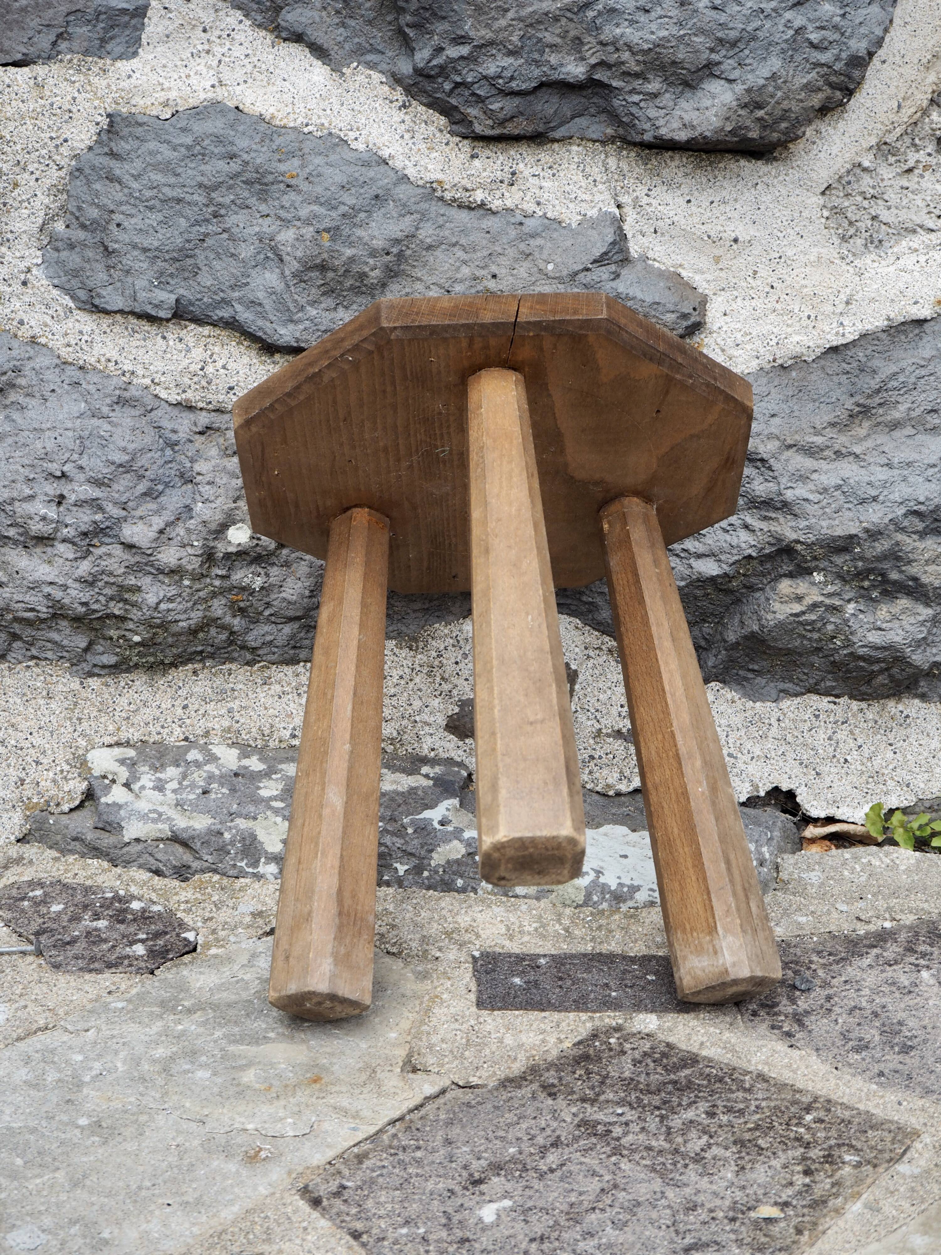 Raw wood tripod stool with octagonal seat