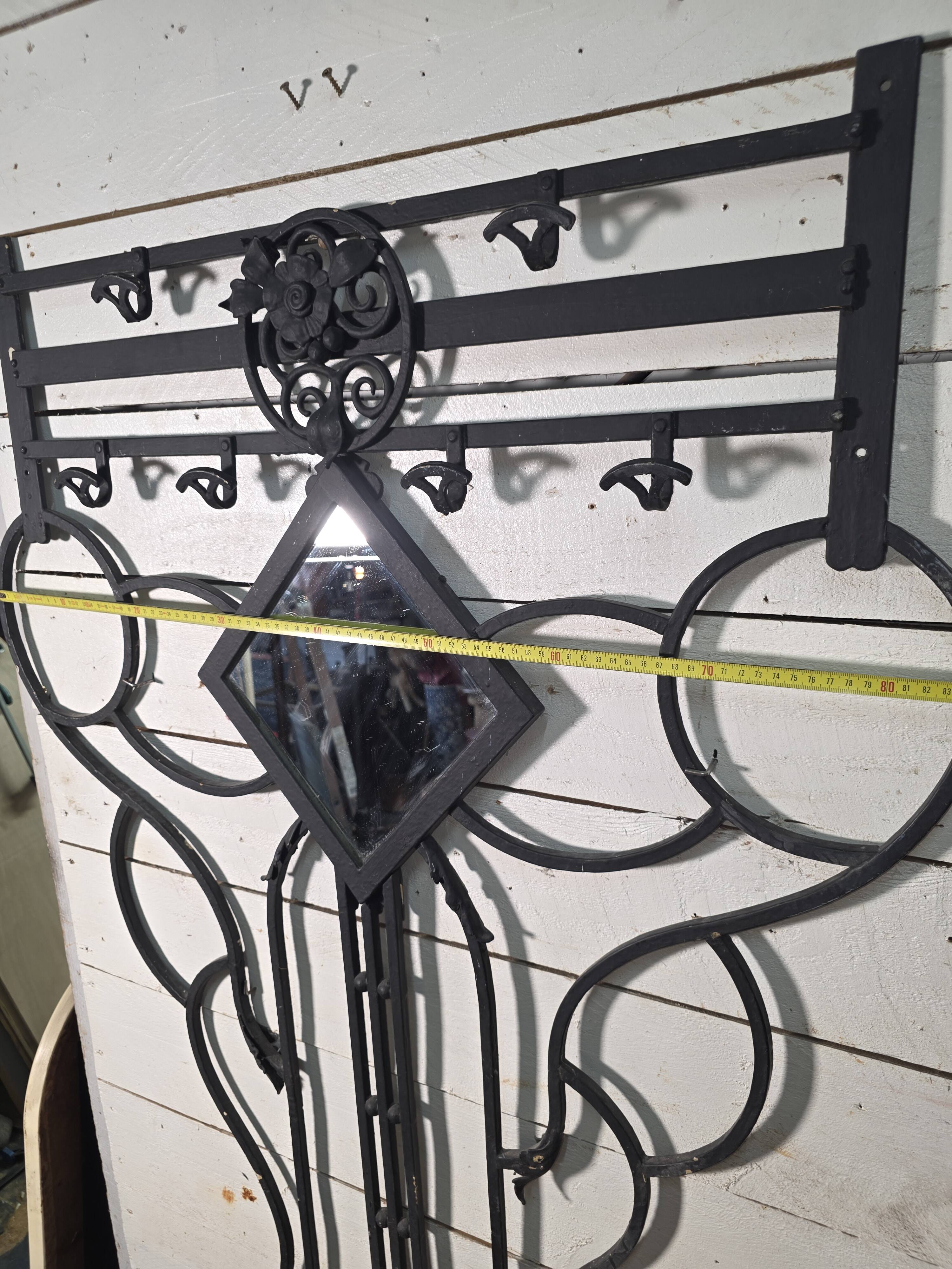 Art Deco coat rack wardrobe in wrought iron from the 1930s.