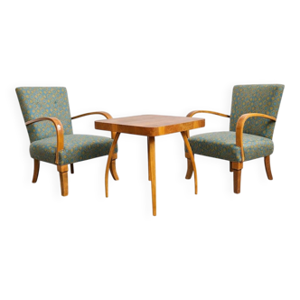 Halabala “Spider” coffee table and Hungarian late Art Deco armchairs, 1950s