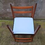 Pair of Scandinavian style chairs in wood and faux leather.