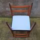 Pair of Scandinavian style chairs in wood and faux leather.