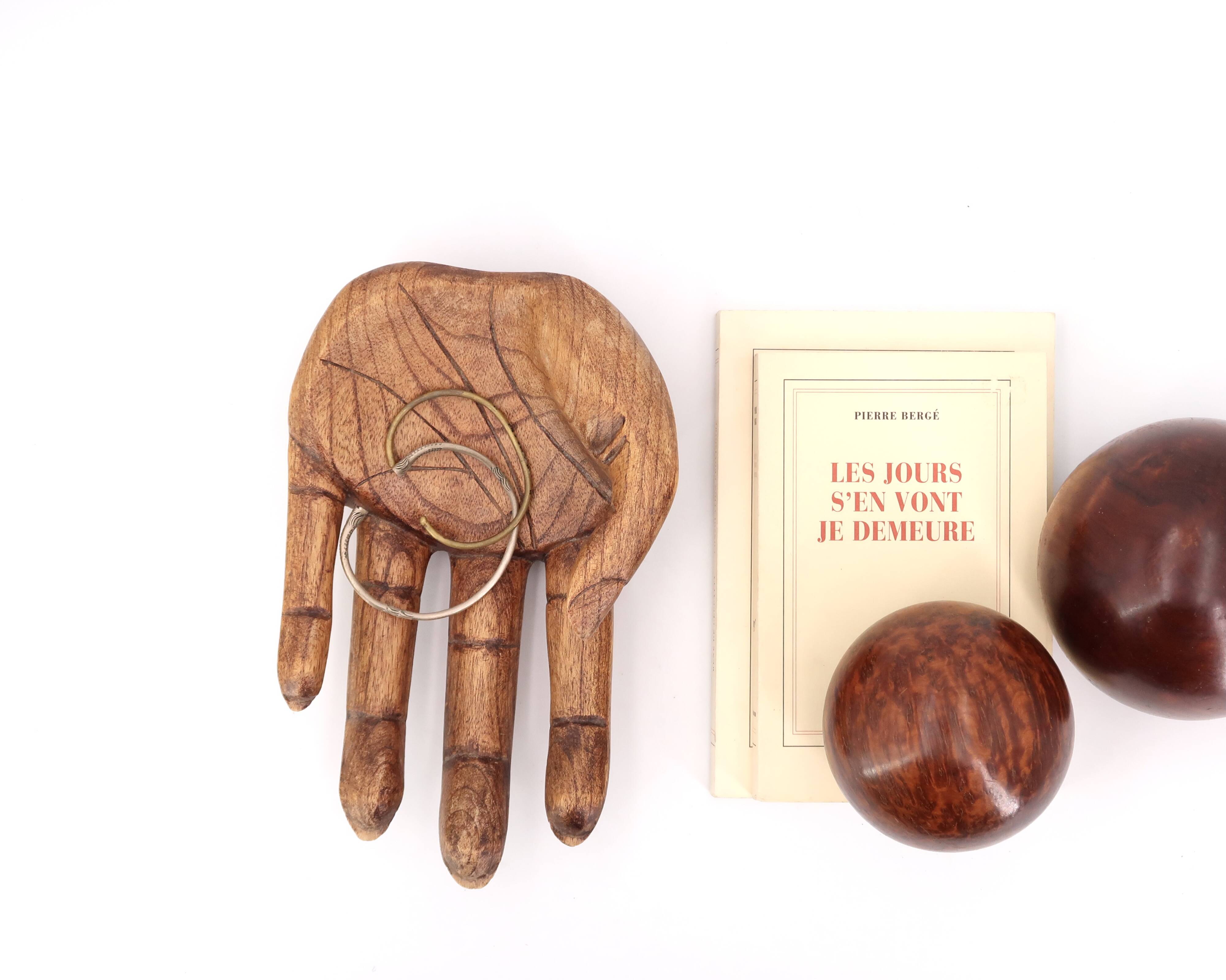 Empty wooden pocket in the shape of a hand, vintage