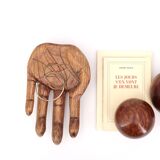 Empty wooden pocket in the shape of a hand, vintage