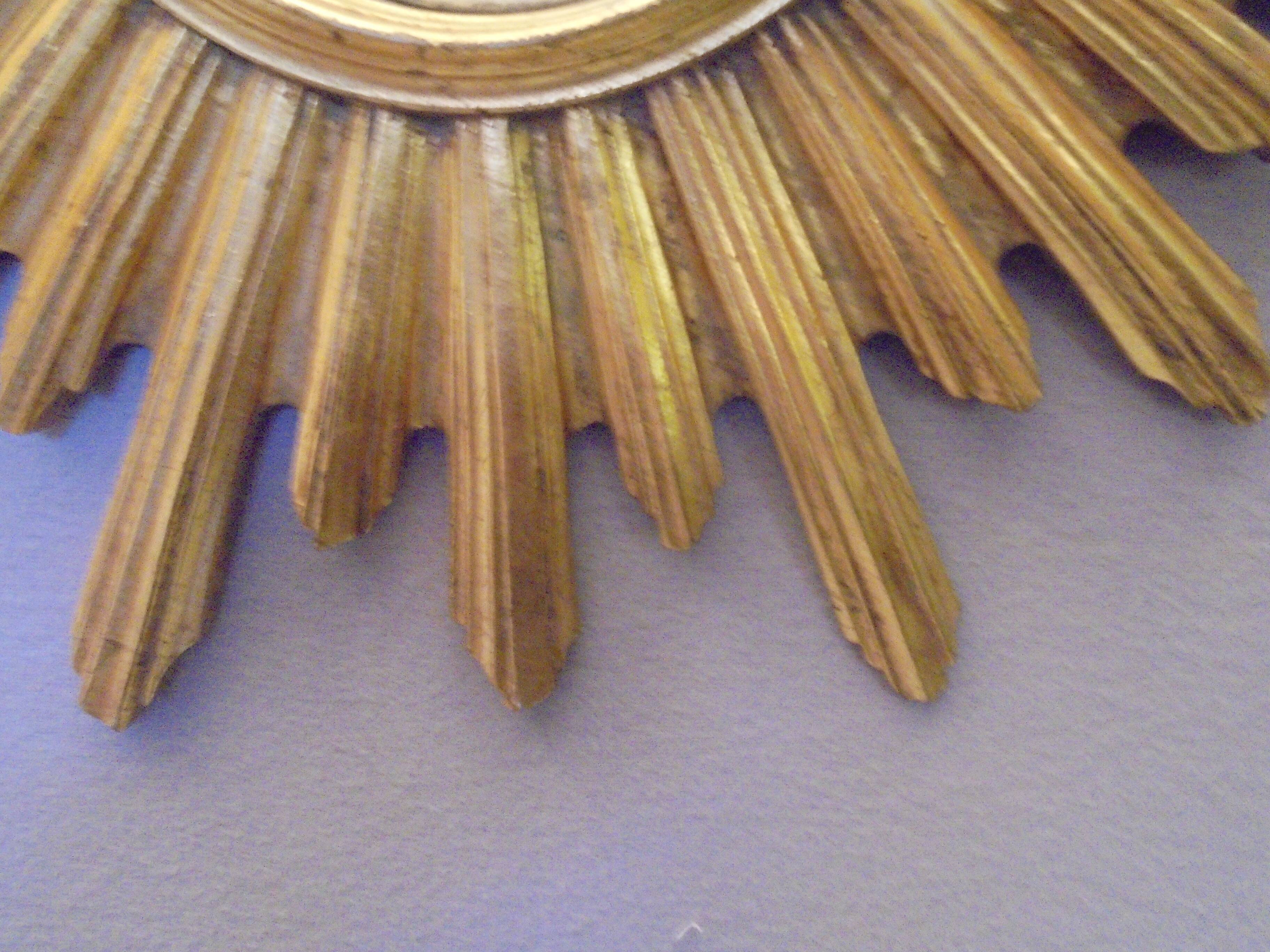 Sun mirror in golden resin from the 70s