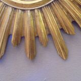 Sun mirror in golden resin from the 70s