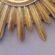 Sun mirror in golden resin from the 70s