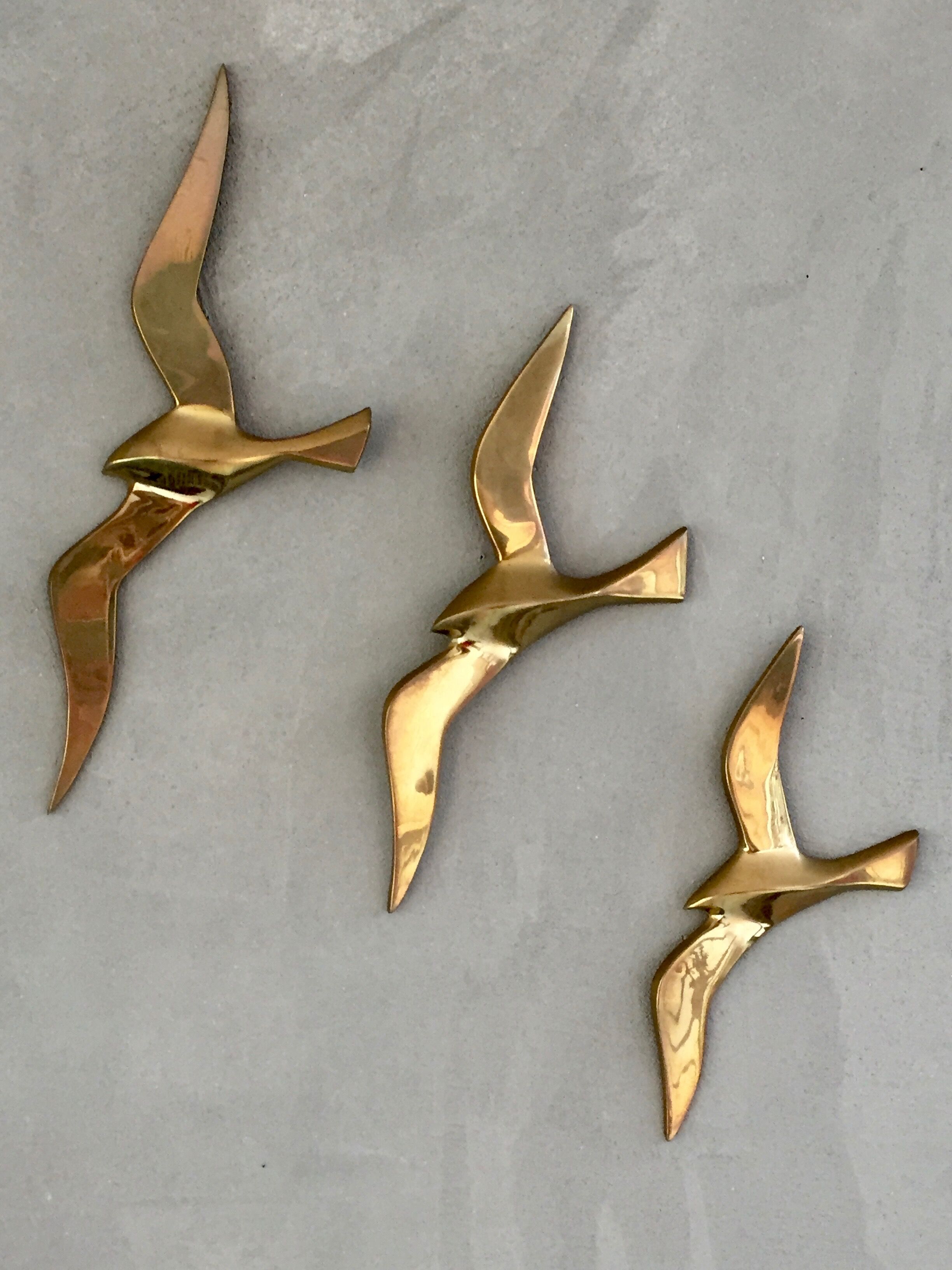 Trio of brass birds