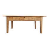 Low farmhouse table in raw wood
