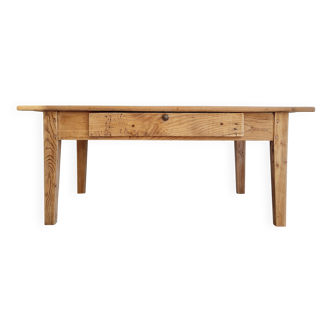 Low farmhouse table in raw wood