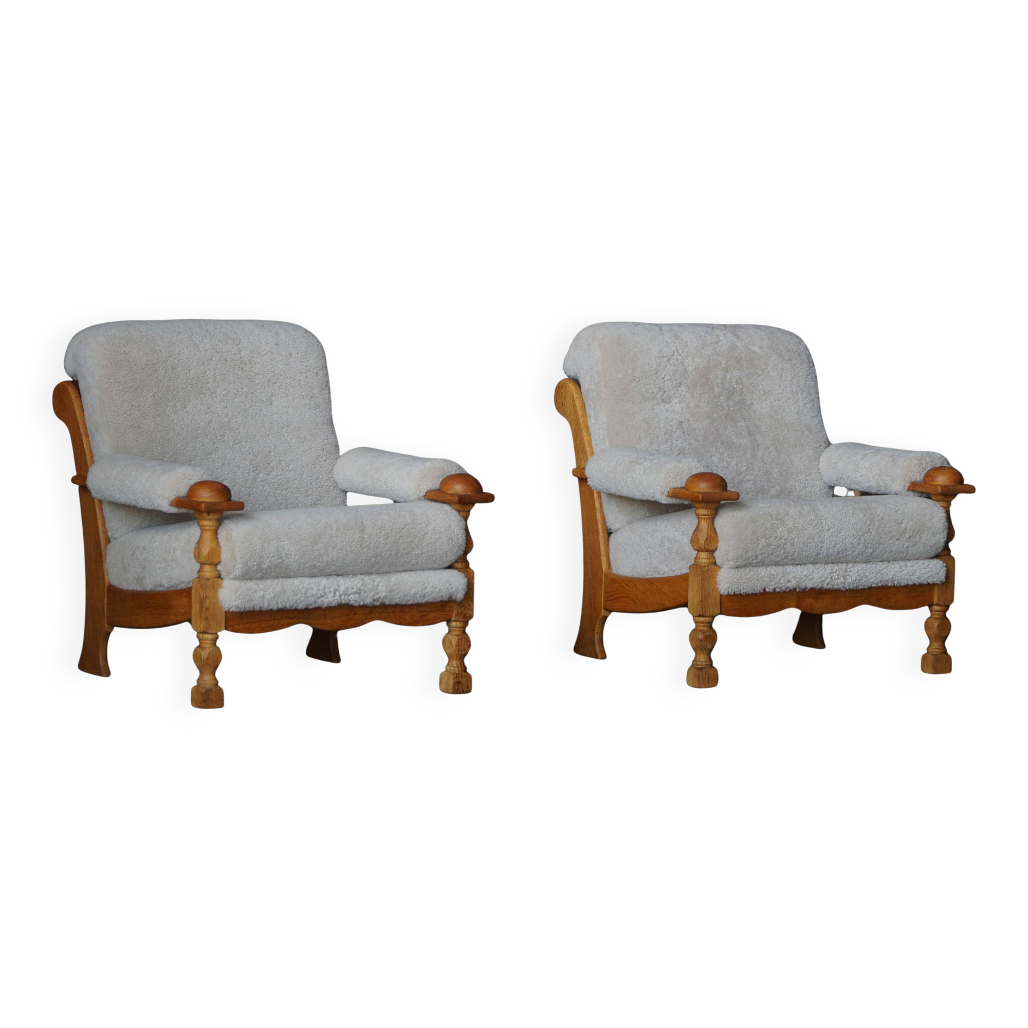 Henning Kjærnulf, lounge chairs in oak and lambswool, mid-century Danish, 1960s.