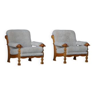 Henning Kjærnulf, lounge chairs in oak and lambswool, mid-century Danish, 1960s.