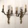 Pair of bronze wall sconces in Louis XV style