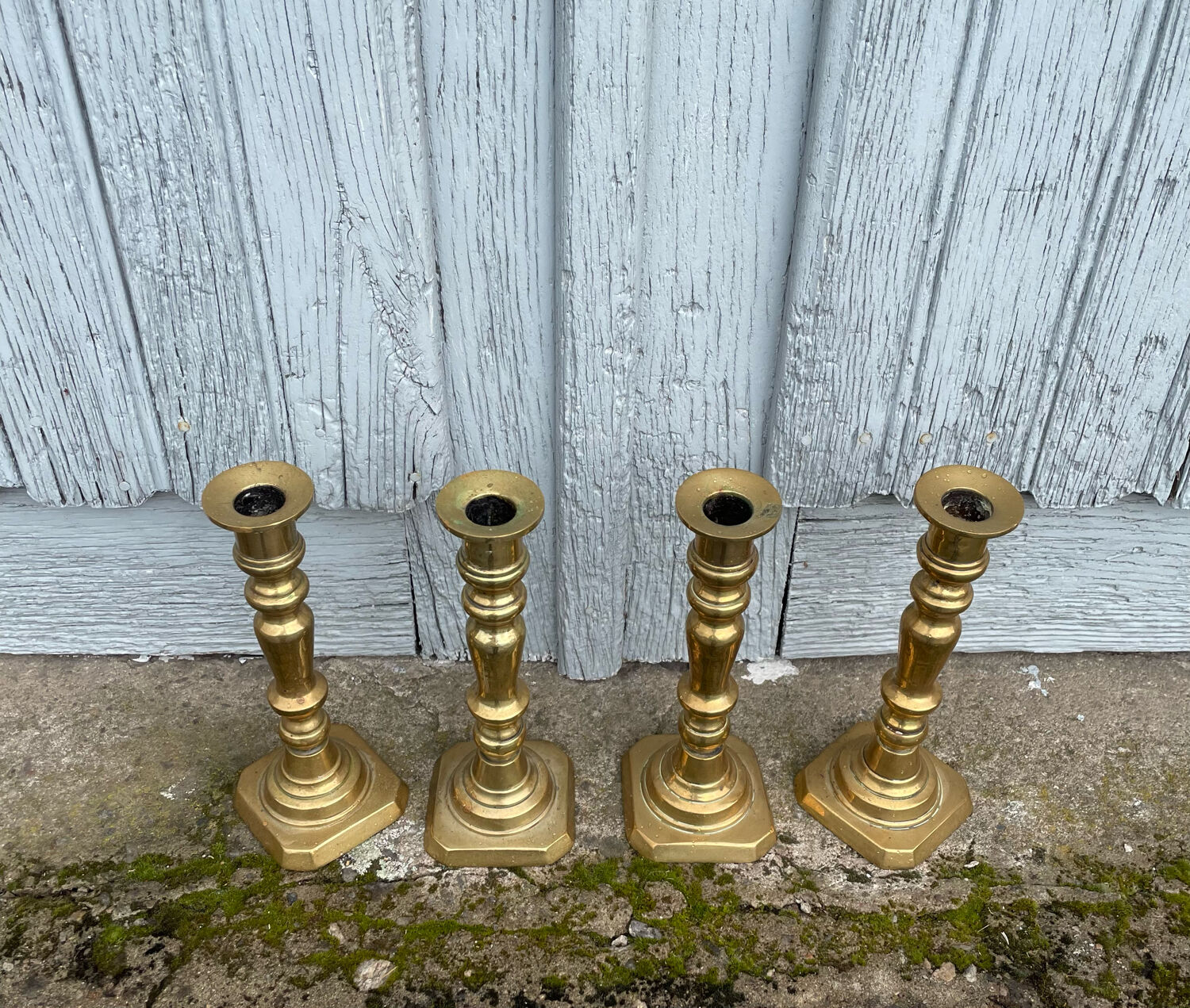 4 Victorian brass candlesticks