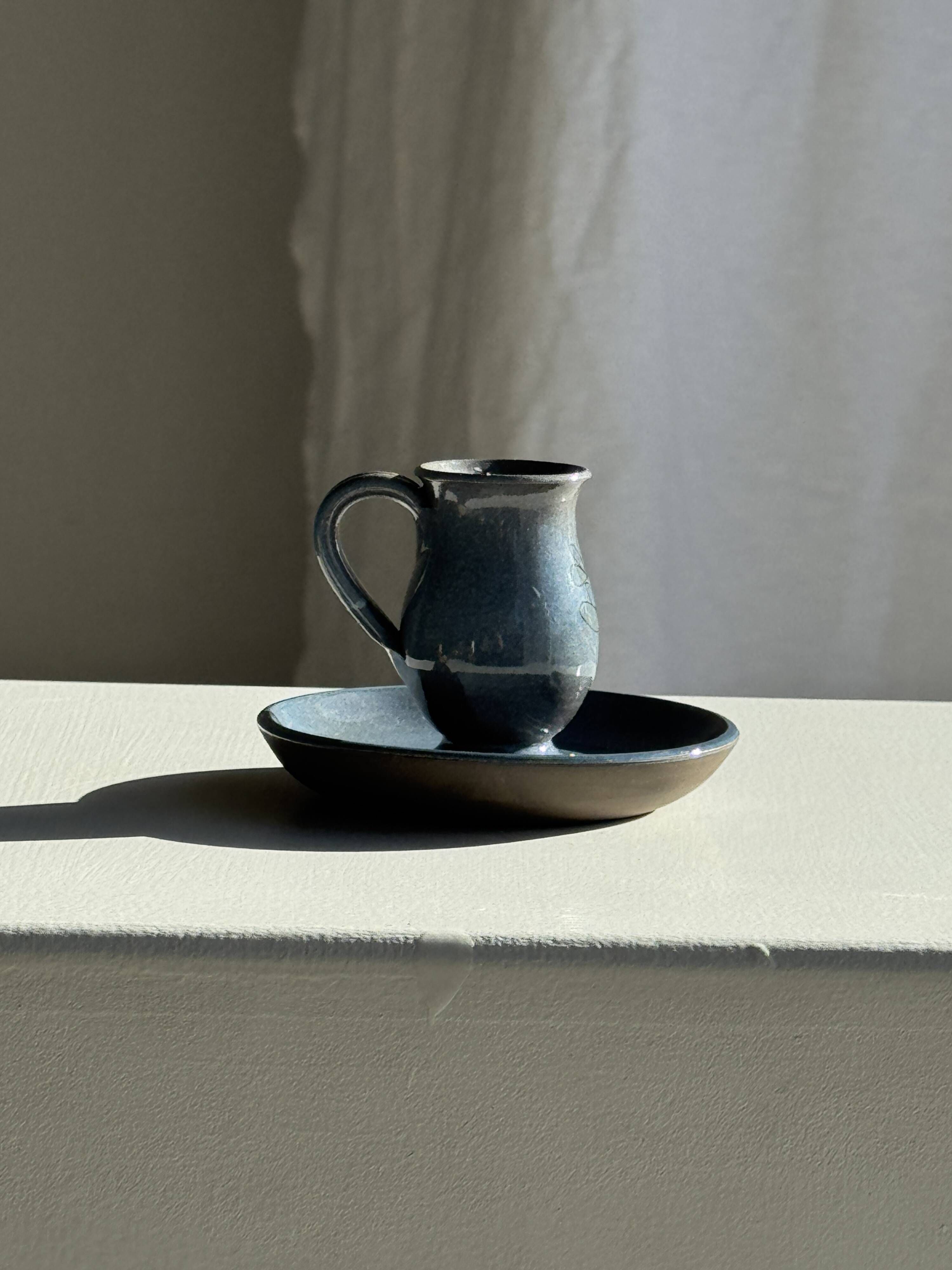 Vintage hand-held candlestick in blue glazed stoneware with floral decoration by Poterie Millian.