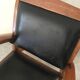 Teak armchair and black leather