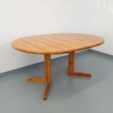 Suite of a round table with extension and 4 vintage pine chairs from the 60s and 70s
