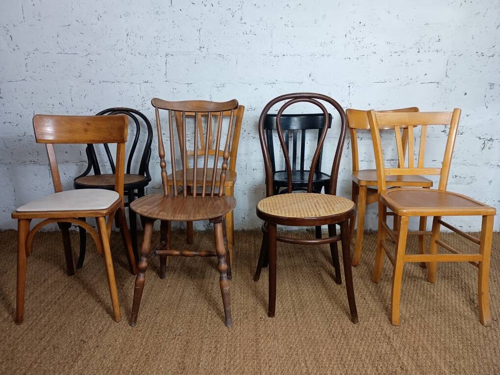 Set of 8 mismatched vintage Baumann Lebrun bistro chairs.