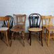 Set of 8 mismatched vintage Baumann Lebrun bistro chairs.