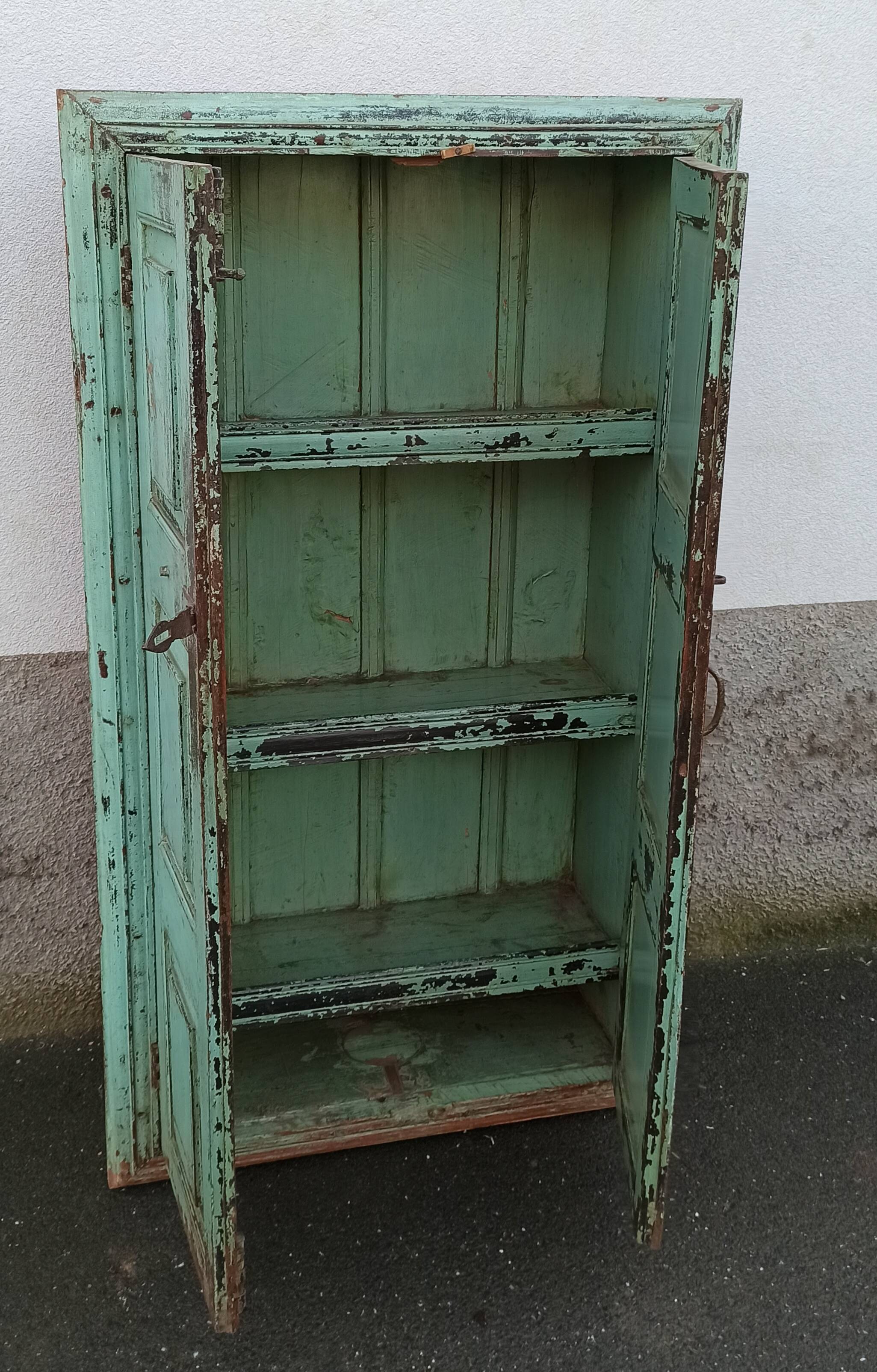 Old wooden cabinet with beautiful green patina