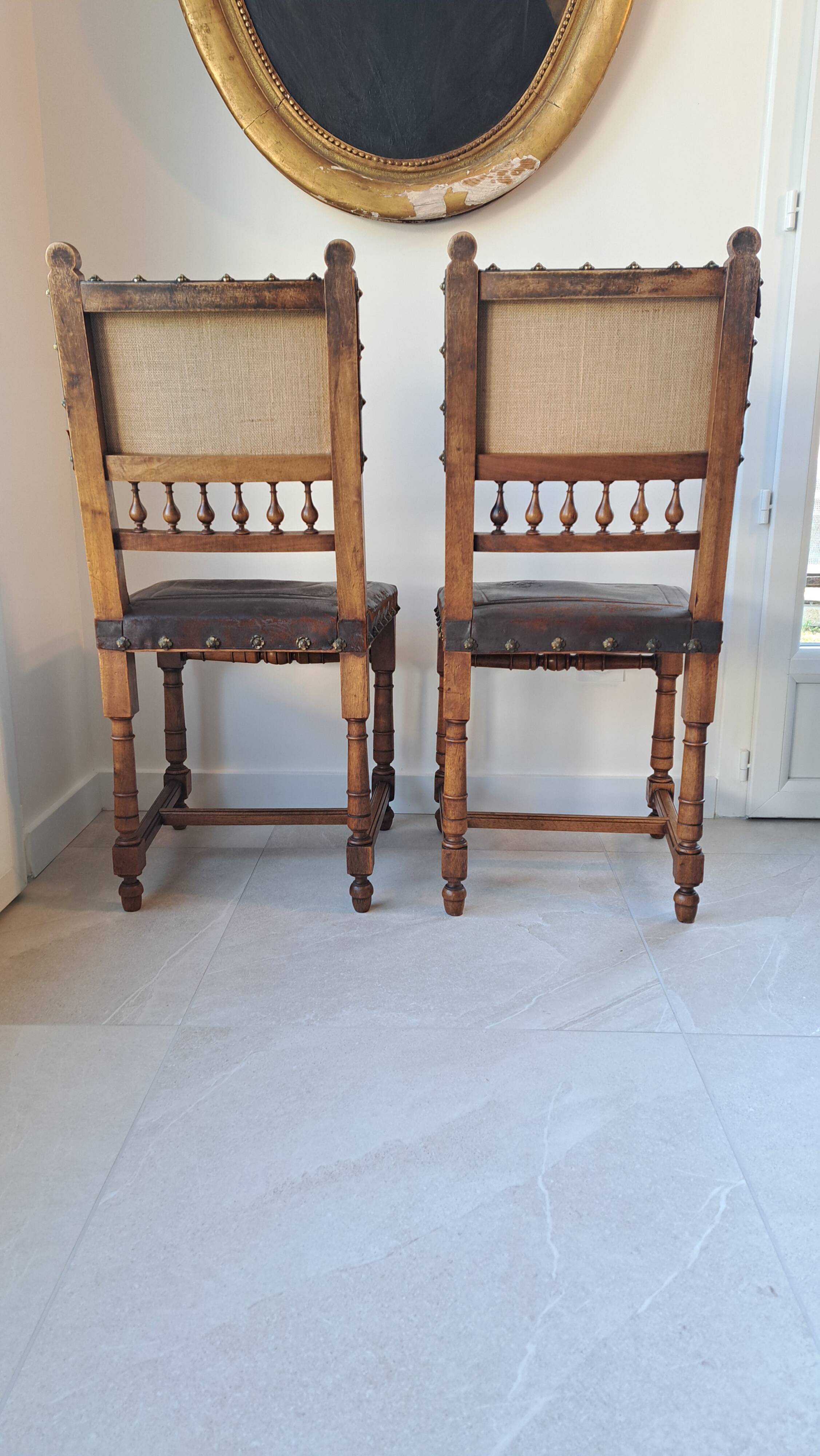 Pair of antique chairs in embossed leather, Henri II style.