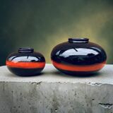 A pair of black and red spherical vases by Bay Keramik, West Germany, from the 1960s.