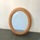 Oval wooden mirror 31x37cm