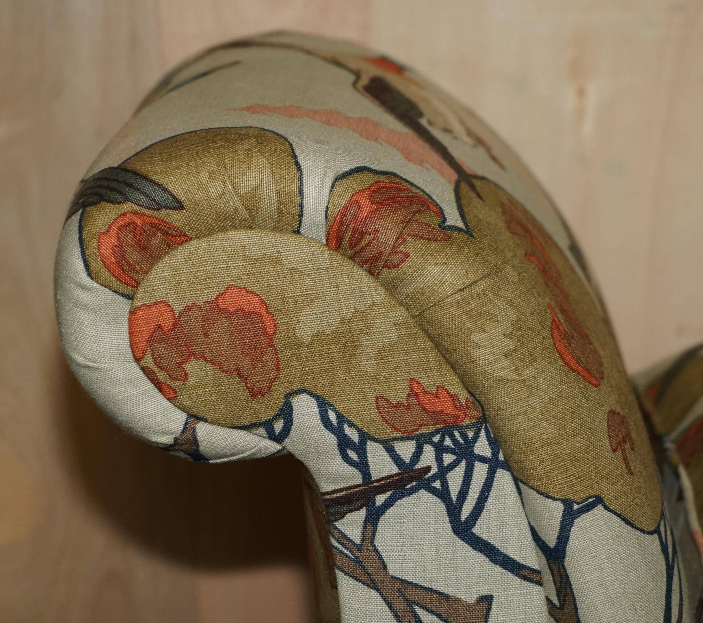 Antique banquette with cluster and ball feet, window seat in Mulberry Flying Ducks fabric.