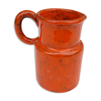 Orange ceramic pitcher