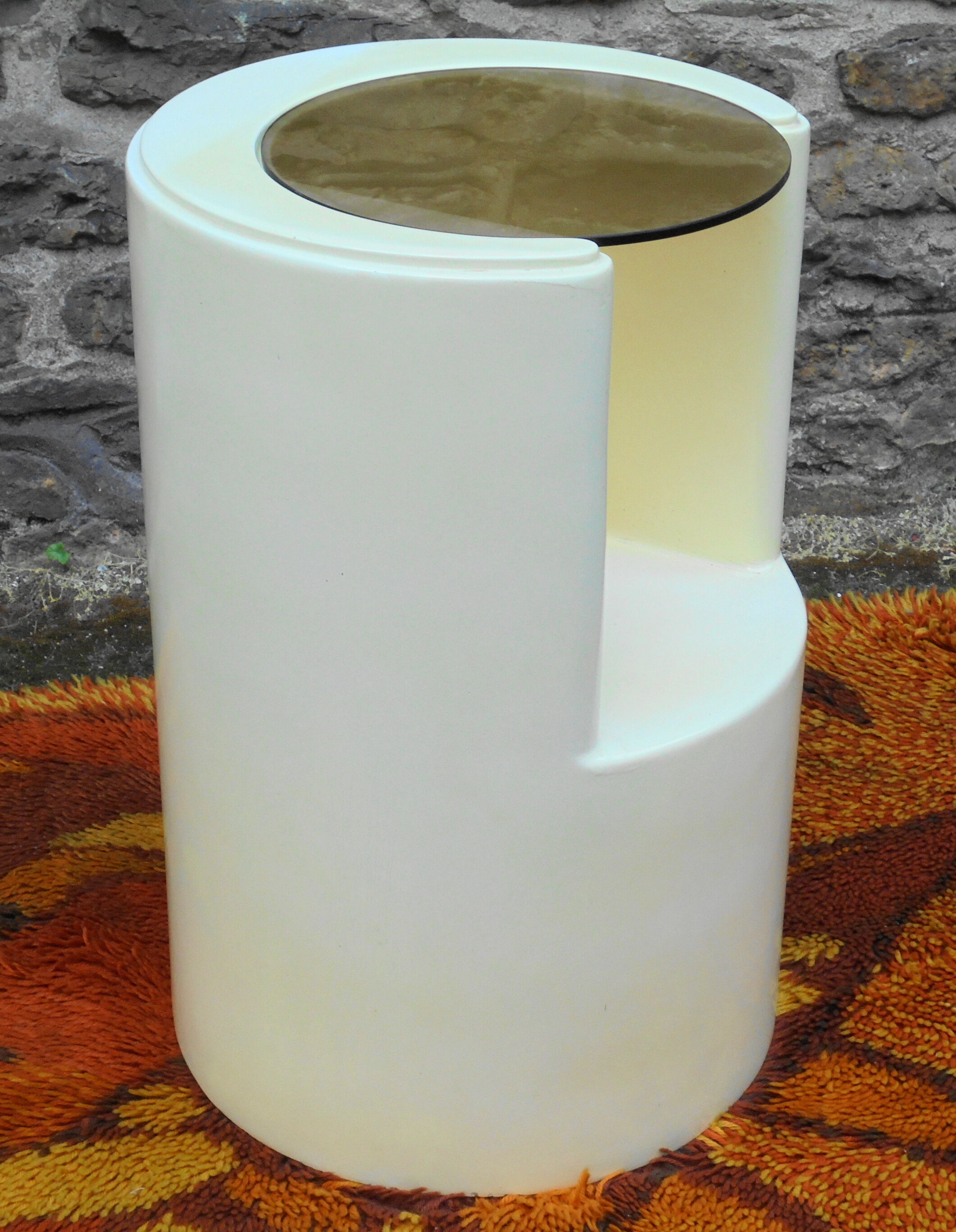 Cylindrical fiberglass bedside table from the 60s