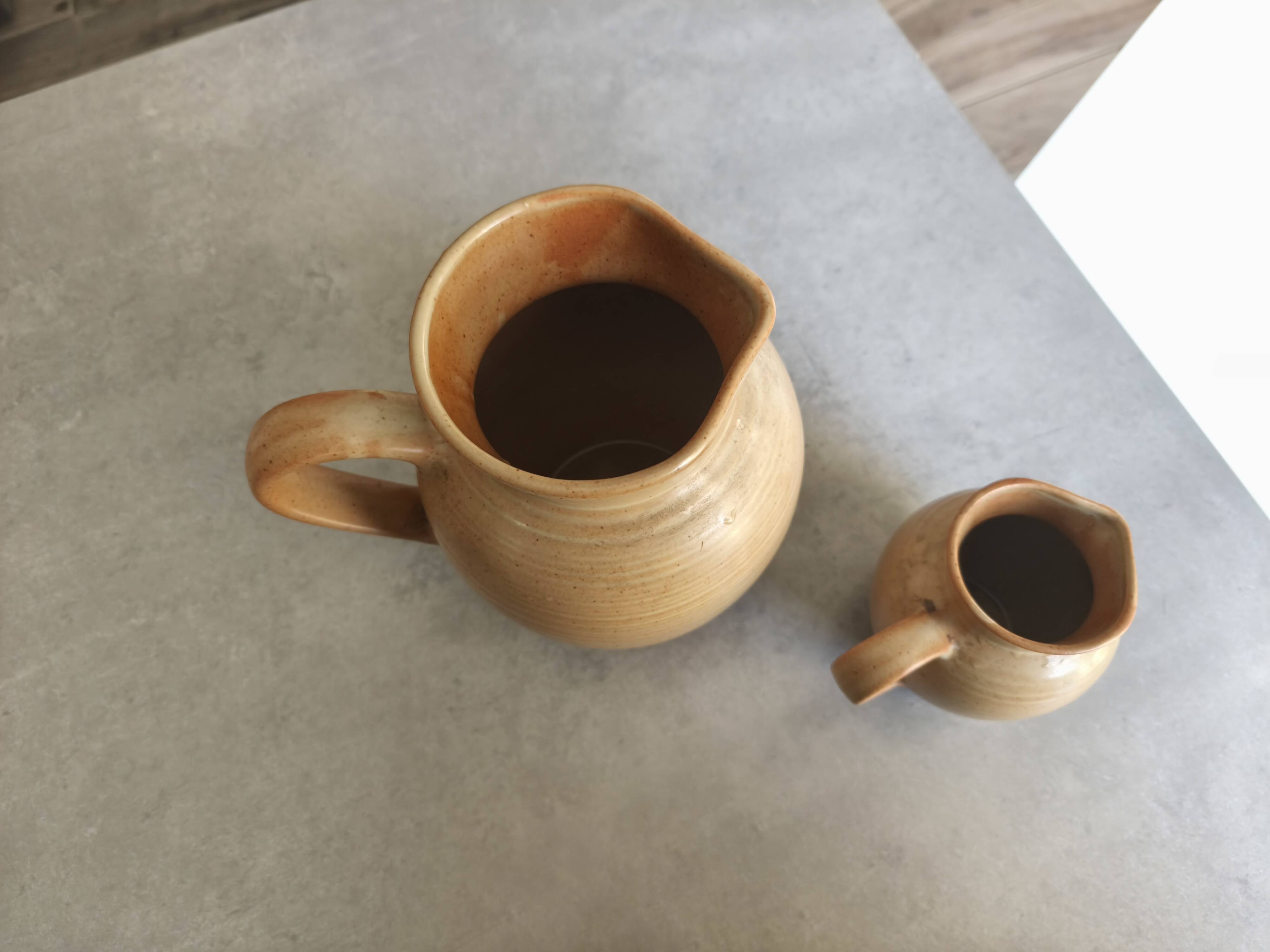 Set of two Village de France stoneware pitchers