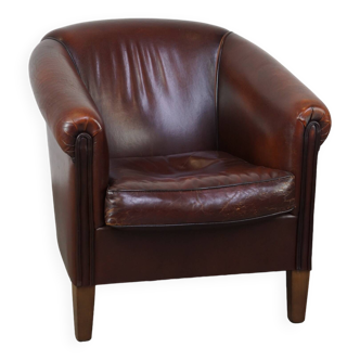 Nice sheepskin club chair with a beautiful patina