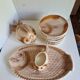 Many flat plates, dish, sauce boat, vegetable dish.