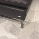 2 black leather sofas roche bobois scenario, one three-seater and one chaise longue.